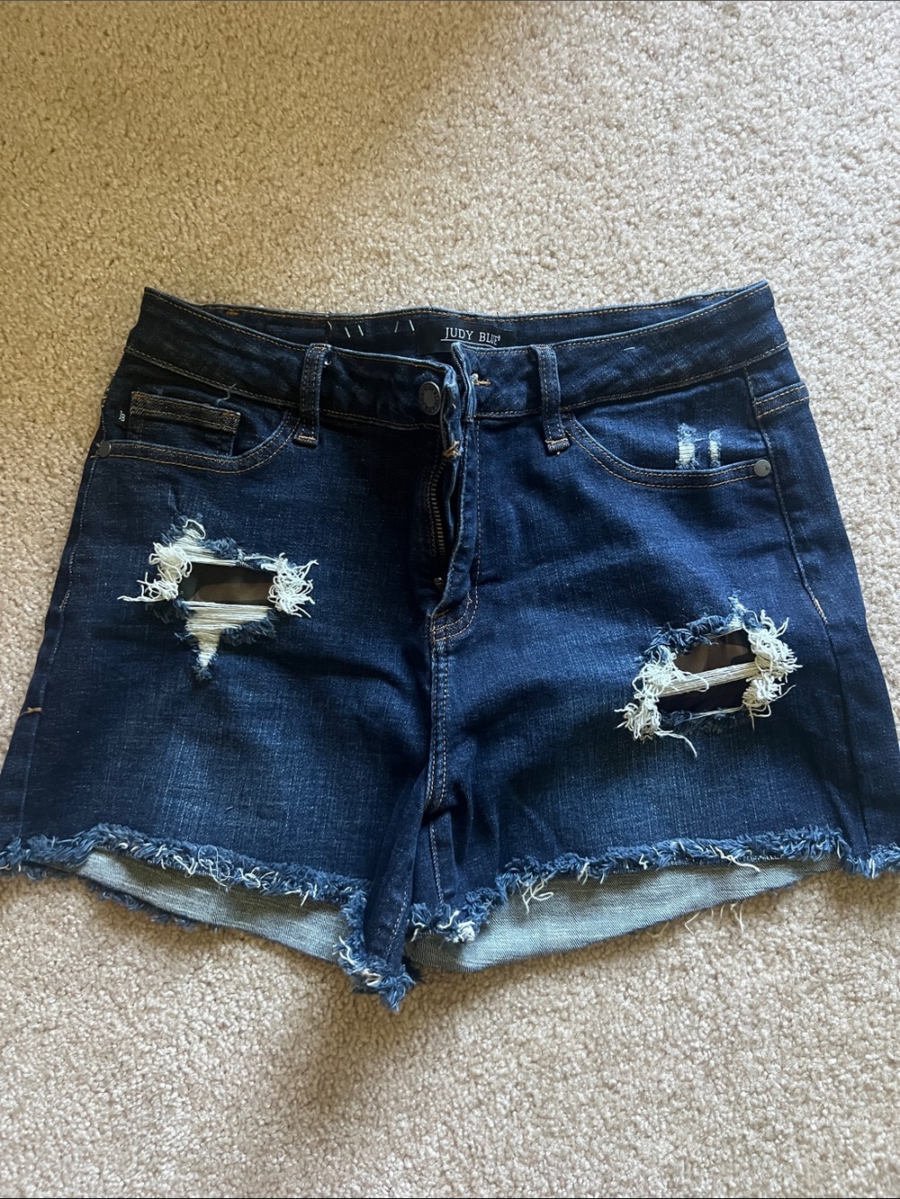 Judy Blue Dark Indigo Distressed Denim Shorts with camo accent